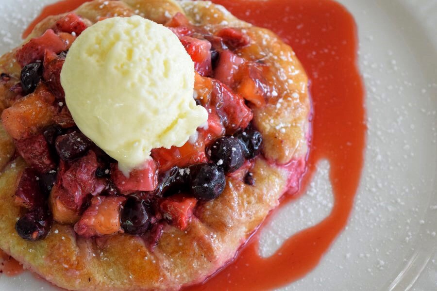 Summer Fruit Crostata rustic tart filled with fresh seasonal fruit, served with GVG buttermilk ice cream and strawberry coulis