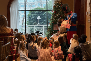 Clara reading the story of the Nutcracker to children attending the O.Henry Hotel Nutcracker Tea.