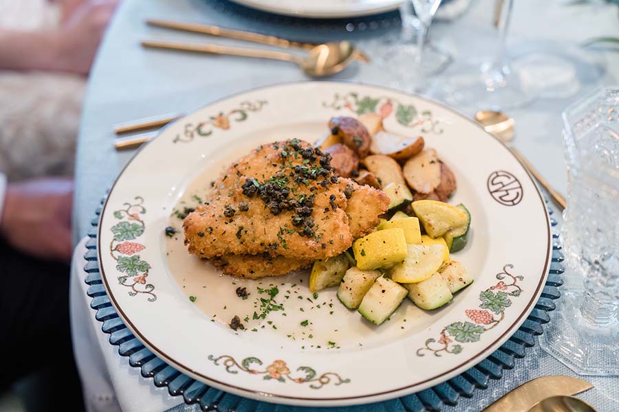 Event Catering, photo of Parmesan Crusted Chicken, lemon-garlic sauce, herb goat cheese, fried capers, mashed potatoes, seasonal vegetable | Photo by In His Image Photography
